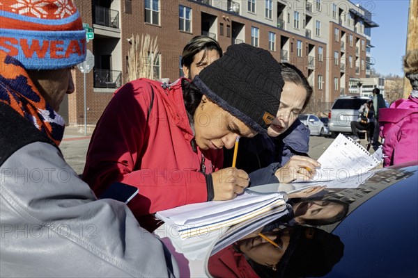 Denver, Colorado, Immigrants, mostly from Venezuela, live in a tent camp near downtown Denver. Those looking for work put their names on a list. The city helped about 35, 000 migrants in 2023 with food and temporary shelter, but more continue to arrive daily on buses from the southern border