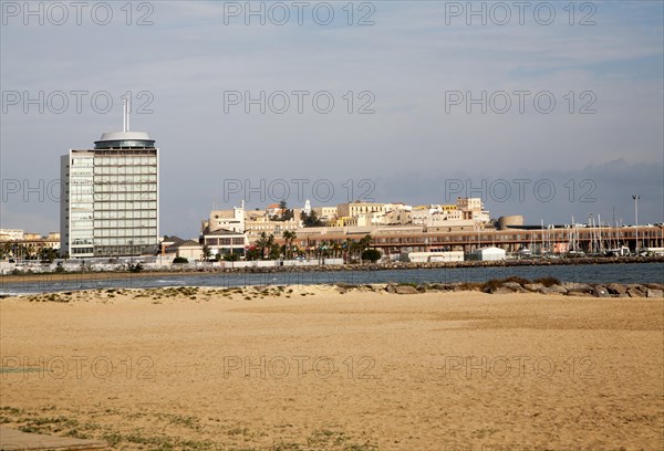 Sandy beach with view to historic walled fort of Melilla la Vieja, Melilla autonomous city state Spanish territory in north Africa, Spain, Europe