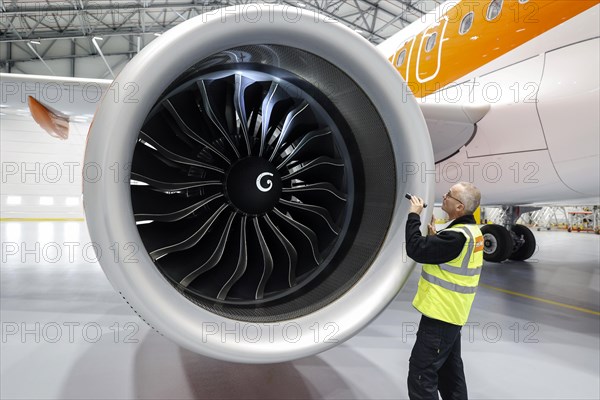 Olaf Gross, Licence Engineer at easyJet, checks the engine of an Airbus A320 Neo in front of the opening of the new easyJet maintenance hangar at Berlin Brandenburg Airport, BER. The entire European easyJet fleet is maintained at the Schoenefeld site