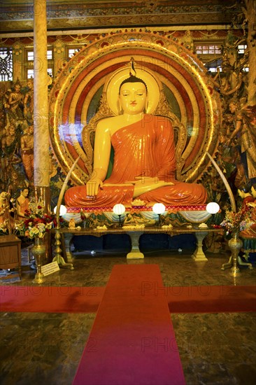 Large Buddha statue Gangaramaya Buddhist Temple, Colombo, Sri Lanka, Asia