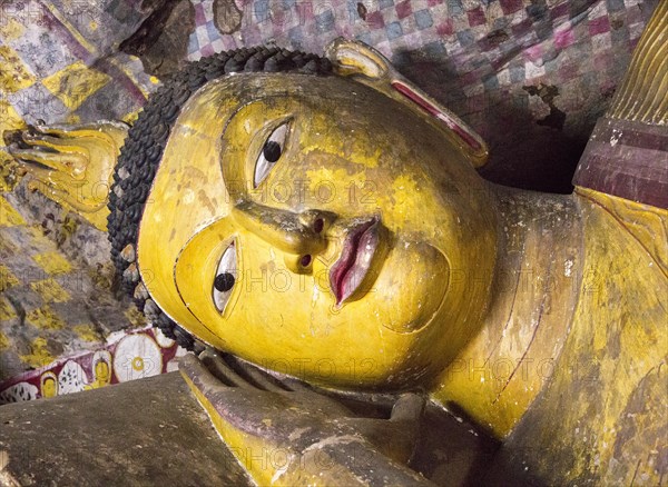 Buddha figure inside Dambulla cave Buddhist temple complex, Sri Lanka, Asia