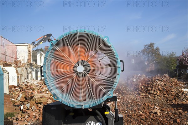 Dehaco water cannon sprayer dampening dust at a demolition site, Woodbridge, Suffolk, England, UK