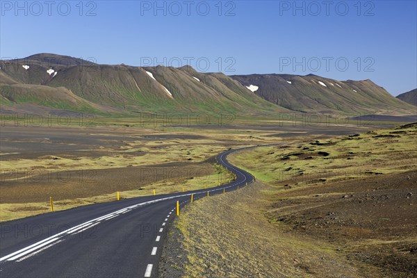 Empty Route 1, Ring Road, winding national road in desolate barren landscape in summer at Austurland, East Iceland