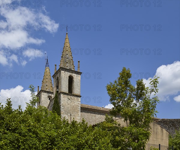 Church tower of L'Abbatiale de Goudargues in Goudargues, Departement Gard, Occitanie region, France, Europe