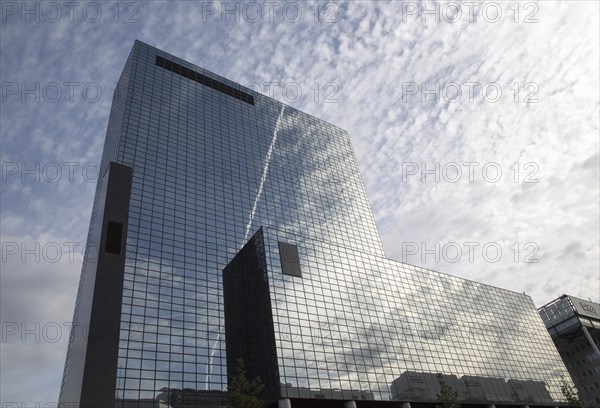 High rise modern glass office block buildings reflecting clouds, Rotterdam, Netherlands