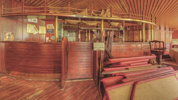 An empty bar with a wooden counter and bar stools that conveys a nostalgic atmosphere, Bad am Park, Lost Place, Essen, North Rhine-Westphalia, Germany, Europe