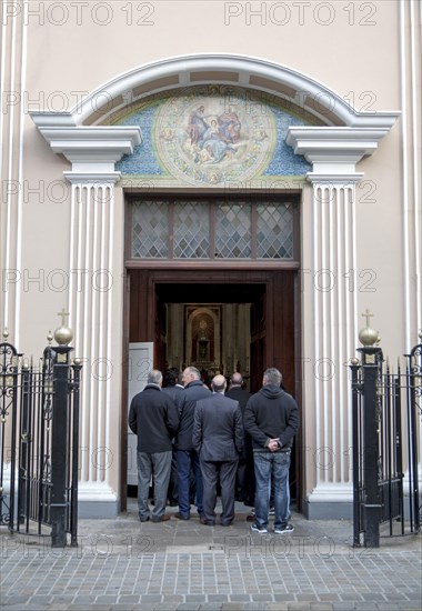 People spilling outside during a funeral at Cathedral of St. Mary the Crowned, Gibraltar, British terroritory in southern Europe, Europe