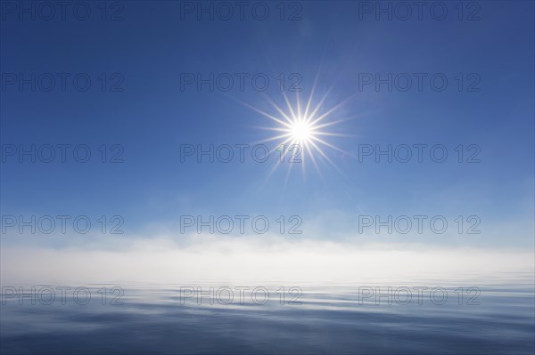 Midnight sun over the Arctic Ocean, north of the Arctic Circle at Nordaustlandet, Svalbard, Spitsbergen, Norway, Europe