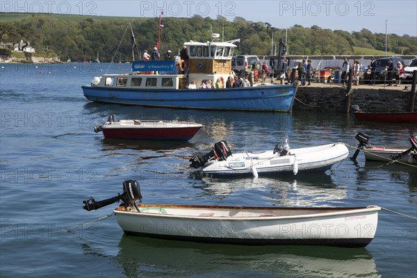 Ferry boat and dinghies in the harbour, St Mawes, Cornwall, England, UK