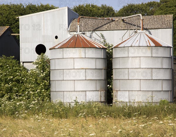 Old steel storage tanks and barns, West Kennet, Wiltshire, England, UK