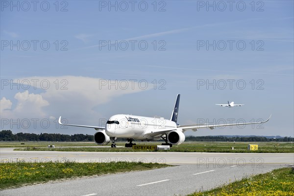 Lufthansa Airbus A350-900 after landing on taxiway from Runway North to Terminal 2, Munich Airport, Upper Bavaria, Bavaria, Germany, Europe