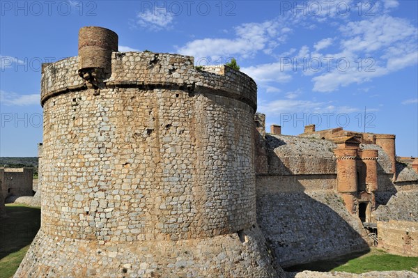 Moat and ramparts of the Catalan fortress Fort de Salses at Salses-le-Chateau, Pyrenees, France, Europe