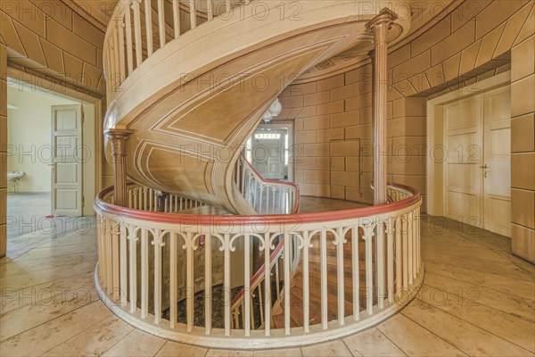 A spiral staircase in an open space with bright interior design and natural lighting, Schachtrupp Villa, Lost Place, Osterode am Harz, Lower Saxony, Germany, Europe