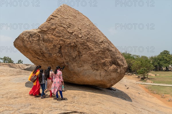 Indian tourists, Krishna's butterball, natural boulder, UNESCO World Heritage Site, Mahabalipuram or Mamallapuram, Tamil Nadu, India, Asia
