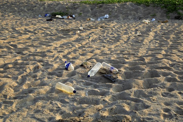 Plastic bottles litter on sandy beach, Nilavelli beach, Trincomalee, Sri Lanka, Asia