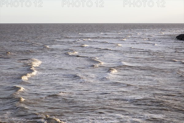 Choppy waves in the North Sea, off East Lane, Bawdsey, Suffolk, England, UK