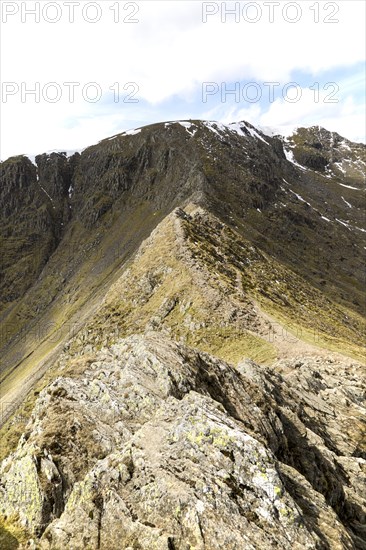 Striding Edge arete and Helvellyn mountain peak, Lake District, Cumbria, England, UK