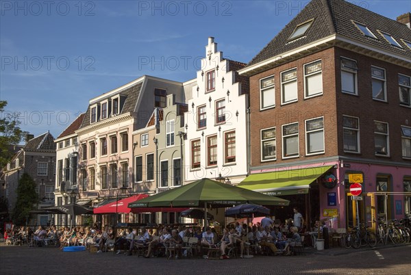 Historic buildings people sitting outside cafes central Utrecht, Netherlands