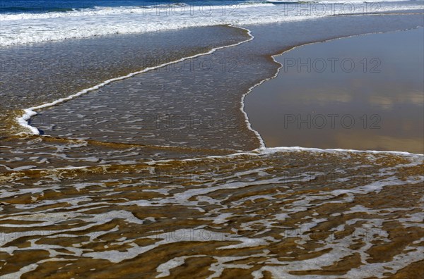 Wave breaking on sandy beach at Conil de la Frontera, Cadiz Province, Spain, Europe