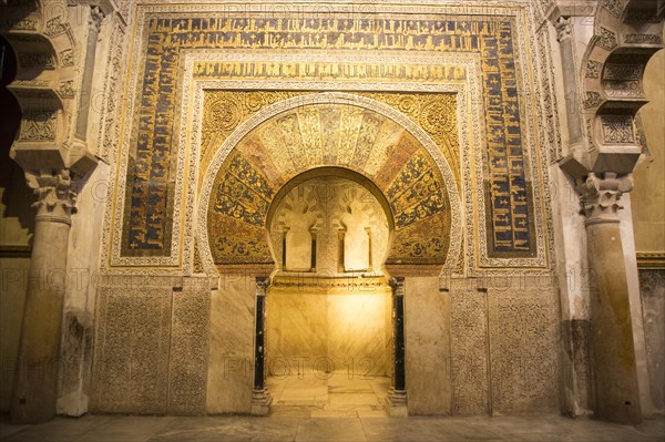 Richly inscribed stonework of keyhole shaped Mihrab, the centrepiece of the Great Mosque, Cordoba, Spain, Europe