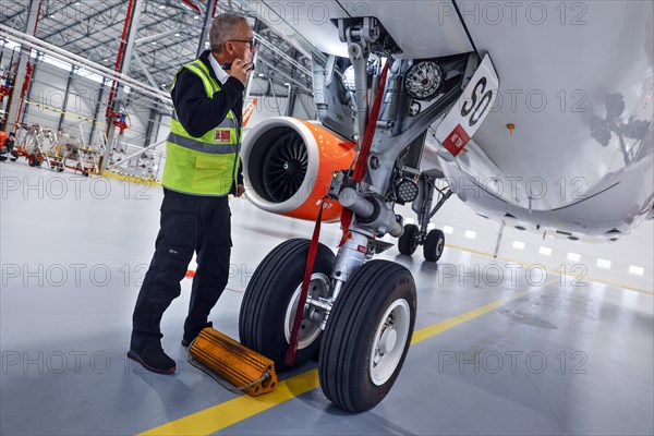 Olaf Gross, Licence Engineer at easyJet, checks the landing gear of an Airbus A320 Neo in front of the opening of the new easyJet maintenance hangar at Berlin Brandenburg Airport, BER. The entire European easyJet fleet is now maintained at the Schoenefeld site, 11.01.2023