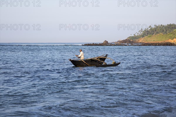 Fishing using traditional outrigger canoes, Mirissa, Sri Lanka, Asia