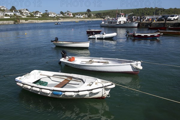 Ferry boat and dinghies in the harbour, St Mawes, Cornwall, England, UK