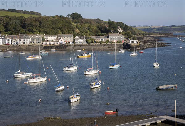 Yachts at moorings on River Fal, Flushing, Cornwall, England, UK