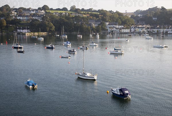 Yachts at moorings on River Fal, Flushing, Cornwall, England, UK
