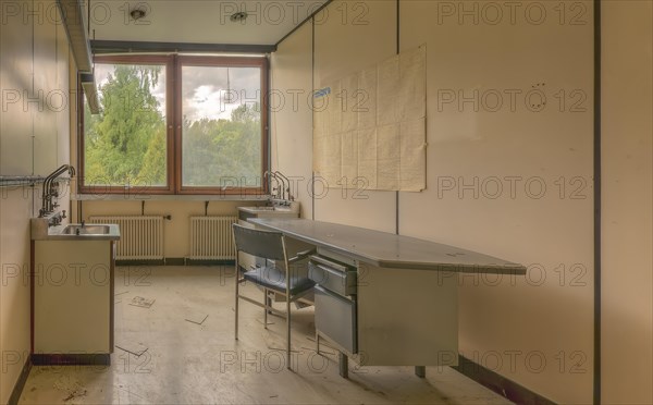 An abandoned laboratory with empty chairs and a blackboard in a dilapidated building, Biotech, abandoned university, Lost Place, Sint-Genesius-Rode, Belgium, Europe