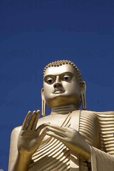 Giant Golden Buddha statue at Dambulla cave temple complex, Sri Lanka, Asia