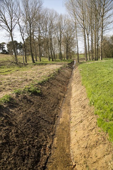 Newly excavated straight drainage ditch, Sutton, Suffolk, England, UK