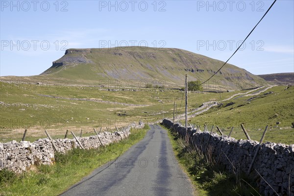 Road and dry stonewalls, Pen Y Ghent, Yorkshire Dales national park, England, UK