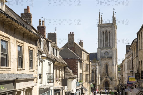 St. Michael's Church tower and buildings in Ironmonger Street, Stamford, Lincolnshire, England, UK
