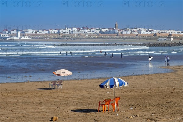 Surfing in the estuary of the river Bou Regreg and view over the commuter town Sale opposite the capital city Rabat, Rabat-Sale-Kenitra, Morocco, Africa