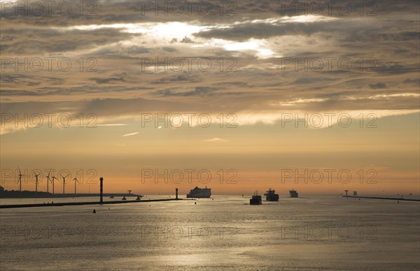 Sunset orange glow landscape clouds water, North Sea shipping, Port of Rotterdam, Hook of Holland, Netherlands