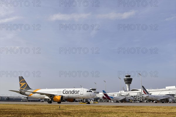 Overview Condor Airbus A320, Air France and Eurowings aircraft at check-in position at Terminal 1 with control tower, Munich Airport, Upper Bavaria, Bavaria, Germany, Europe