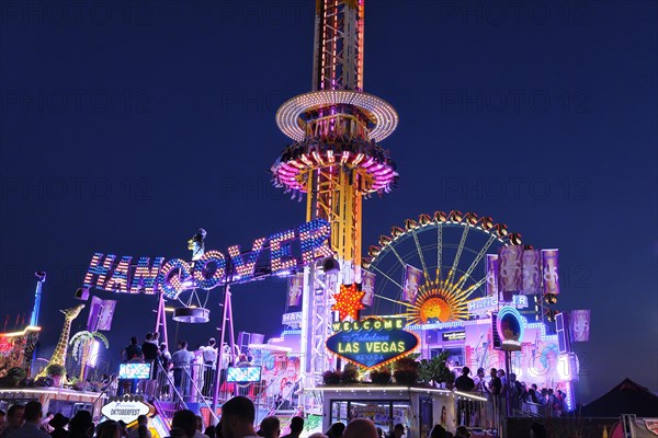 Oktoberfest, evening, illuminated fairground ride HANGOVER, Munich, Bavaria, Germany, Europe