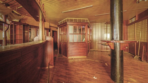 Abandoned bar with wooden counter and interior design that conveys a nostalgic atmosphere, Bad am Park, Lost Place, Essen, North Rhine-Westphalia, Germany, Europe