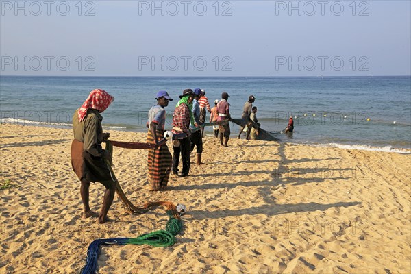 Traditional fishing hauling nets Nilavelli beach, near Trincomalee, Eastern province, Sri Lanka, Asia