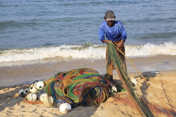 Traditional fishing hauling nets Nilavelli beach, near Trincomalee, Eastern province, Sri Lanka, Asia