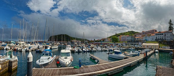 Lively harbour of Horta with many boats and surrounding mountains, Horta, Faial Island, Azores, Portugal, Europe