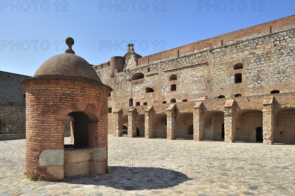Inner court and well of the Catalan fortress Fort de Salses at Salses-le-Chateau, Pyrenees, France, Europe