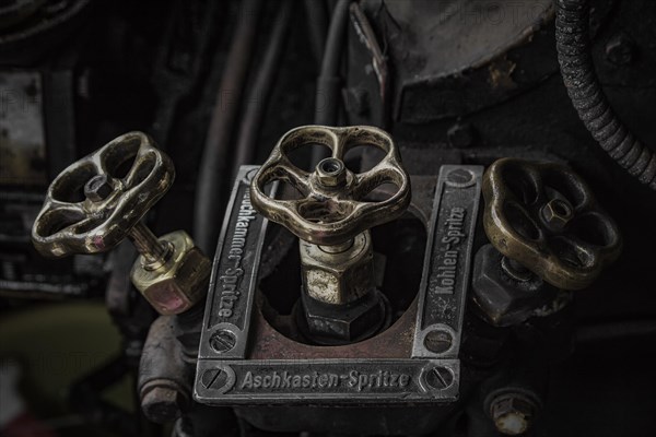 Antique brass valves with inscriptions in the controls of a locomotive, Dahlhausen railway depot, Lost Place, Dahlhausen, Bochum, North Rhine-Westphalia, Germany, Europe