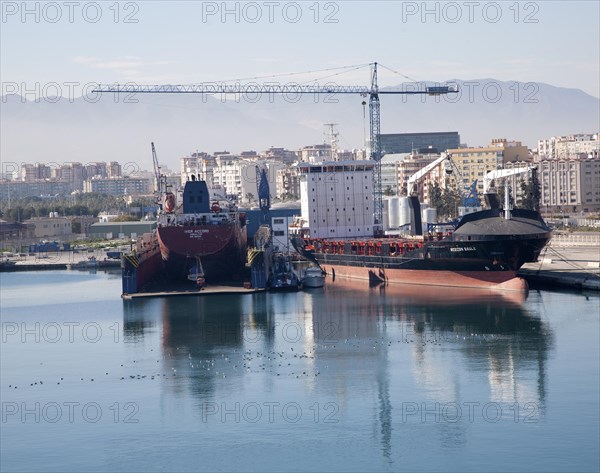 Cargo ships in the port of Malaga, Spain, Europe