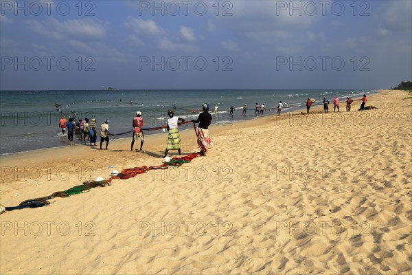 Traditional fishing hauling nets Nilavelli beach, near Trincomalee, Eastern province, Sri Lanka, Asia