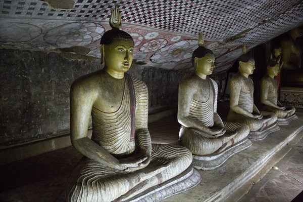 Buddha figures inside Dambulla cave Buddhist temple complex, Sri Lanka, Asia