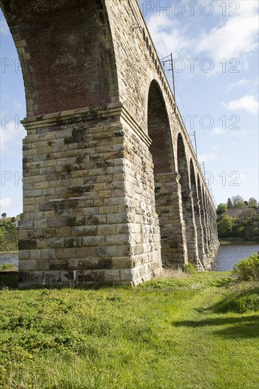 Stone arches of railway viaduct crossing River Tweed, Berwick-upon-Tweed, Northumberland, England, UK