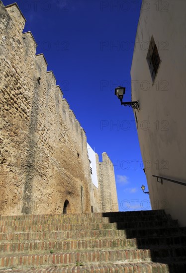 Historic street and castle walls in the village of Vejer de la Frontera, Cadiz Province, Spain, Europe