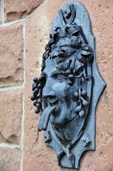 Fountain with Bacchus figure in the vineyards at Dambach-la-Ville, Vosges, Alsace, France, Europe